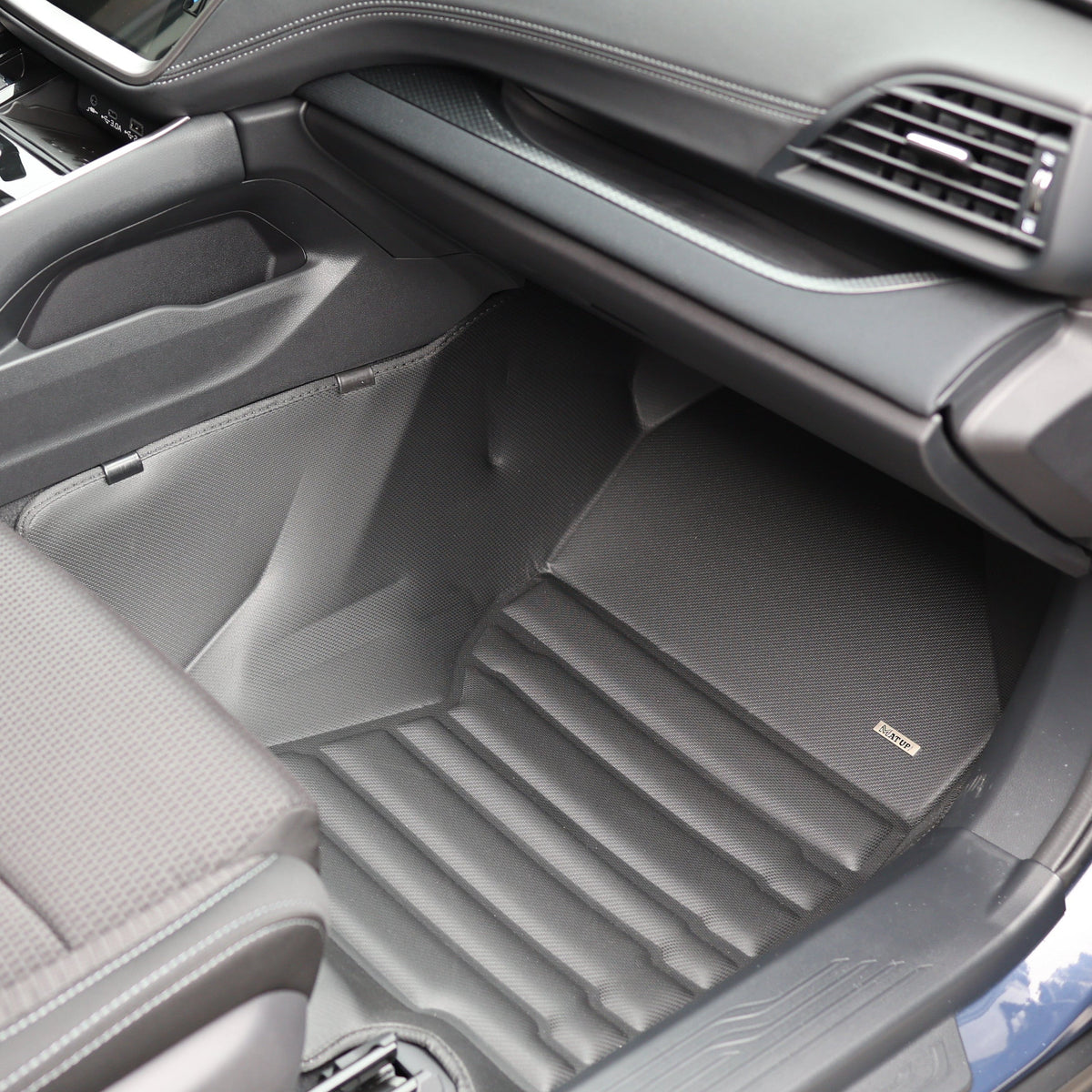 Mat Up! custom-fit all-weather floor mats installed in a vehicle footwell