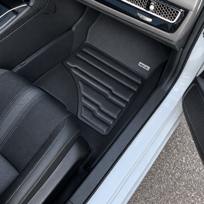 Mat Up! custom-fit all-weather floor mats installed in a vehicle footwell