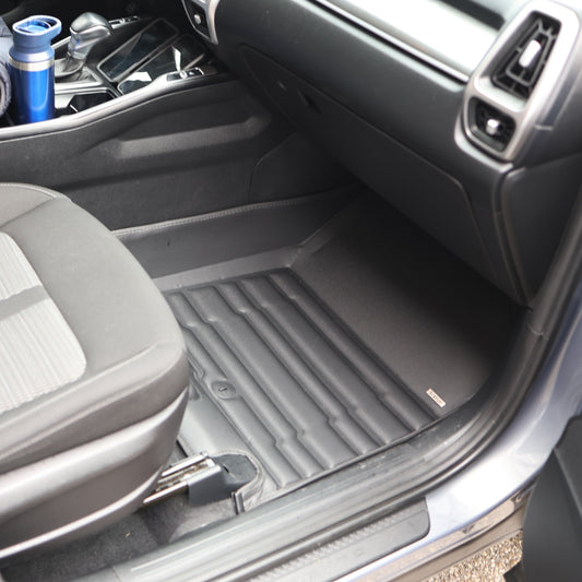 Mat Up! custom-fit all-weather floor mats installed in a vehicle footwell