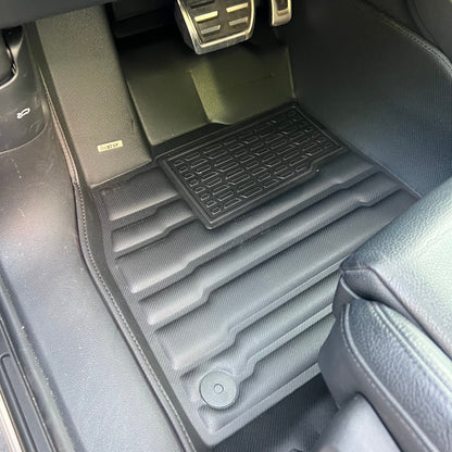 Mat Up! custom-fit all-weather floor mats installed in a vehicle footwell