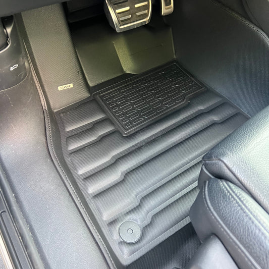 Mat Up! custom-fit all-weather floor mats installed in a vehicle footwell