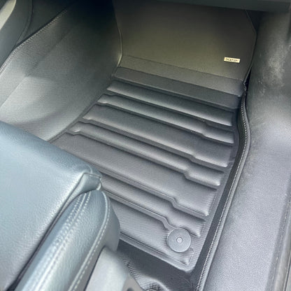 Mat Up! custom-fit all-weather floor mats installed in a vehicle footwell
