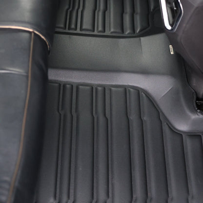 Mat Up! custom-fit all-weather floor mats installed in a vehicle footwell