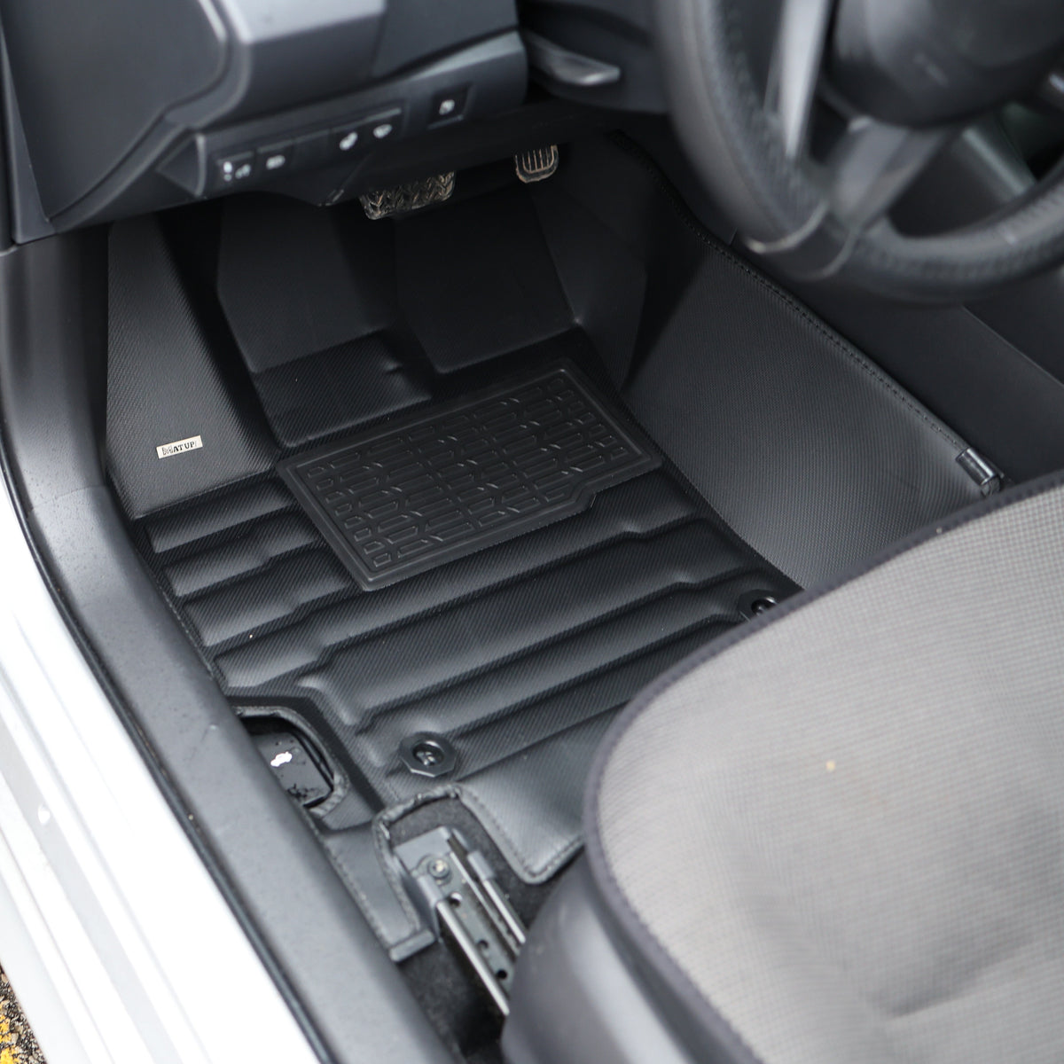 Mat Up! custom-fit all-weather floor mats installed in a vehicle footwell