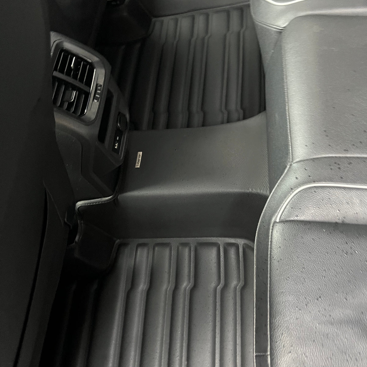 Mat Up! custom-fit all-weather floor mats installed in a vehicle footwell