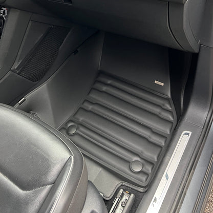 Mat Up! custom-fit all-weather floor mats installed in a vehicle footwell
