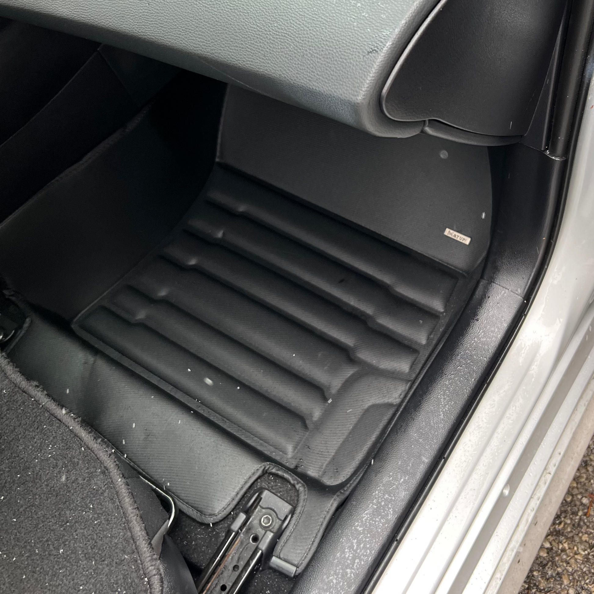 Mat Up! custom-fit all-weather floor mats installed in a vehicle footwell