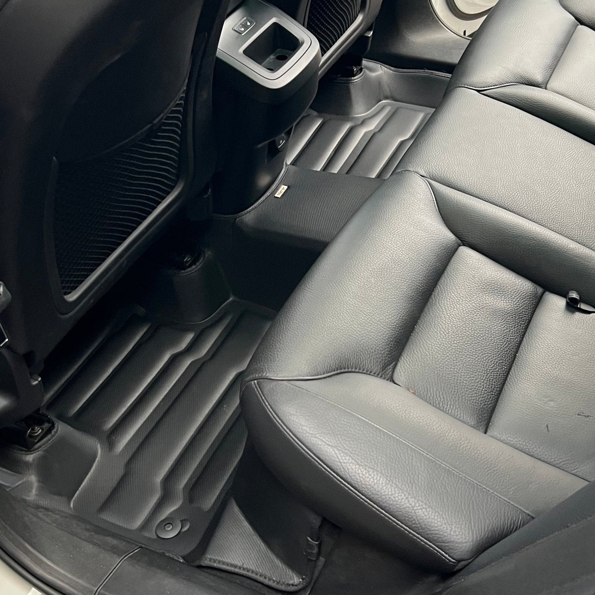 Mat Up! custom-fit all-weather floor mats installed in a vehicle footwell